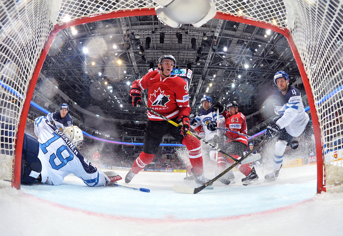 MOSCOW, RUSSIA - MAY 22: Canada's Connor McDavid #97 gets the puck past Finland's Mikko Koskinen #19 to score a first period goal with Brad Marchand #63, Jarno Koskiranta #40 and Tommi Kivisto #4 looking on during gold medal game action at the 2016 IIHF Ice Hockey World Championship. (Photo by Andre Ringuette/HHOF-IIHF Images)

